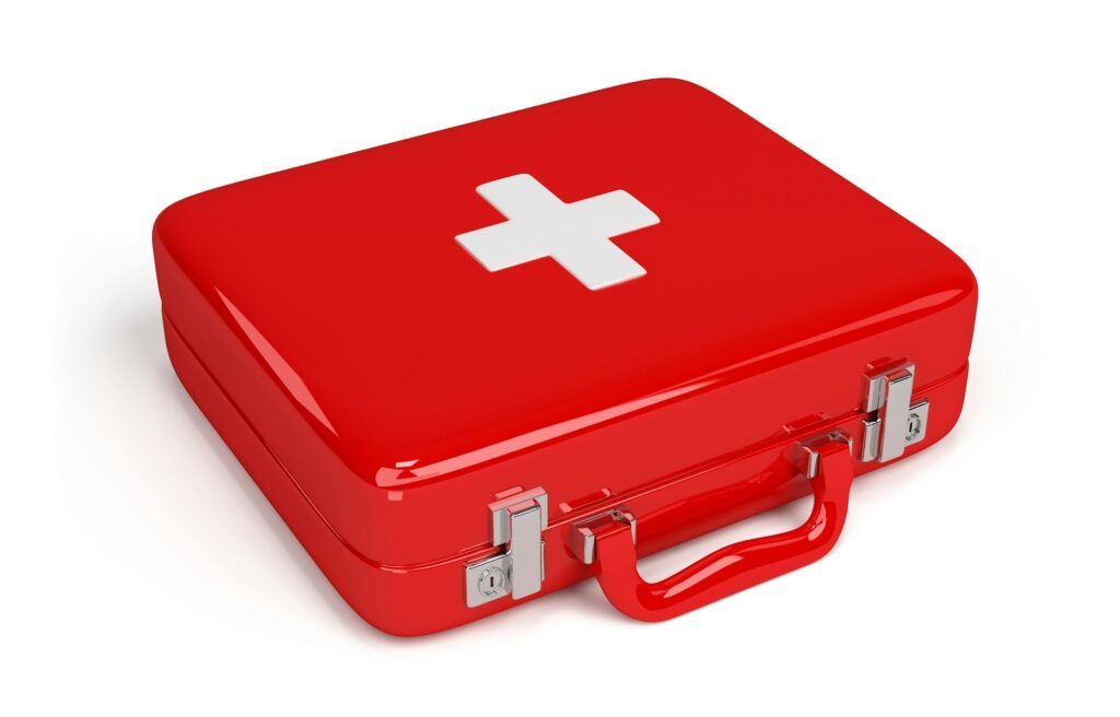 First aid kit concept, medicine equipment set in a suitcase box